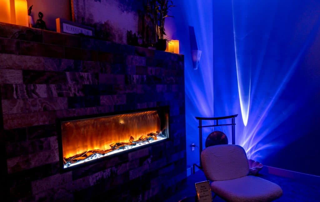 Cool blue mood lighting in the massage therapy room