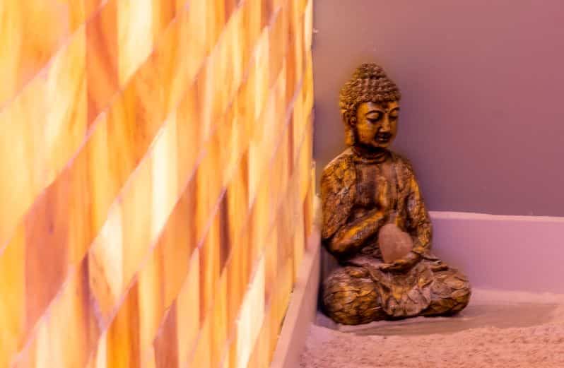 Close up of Buddha statue in salt therapy room